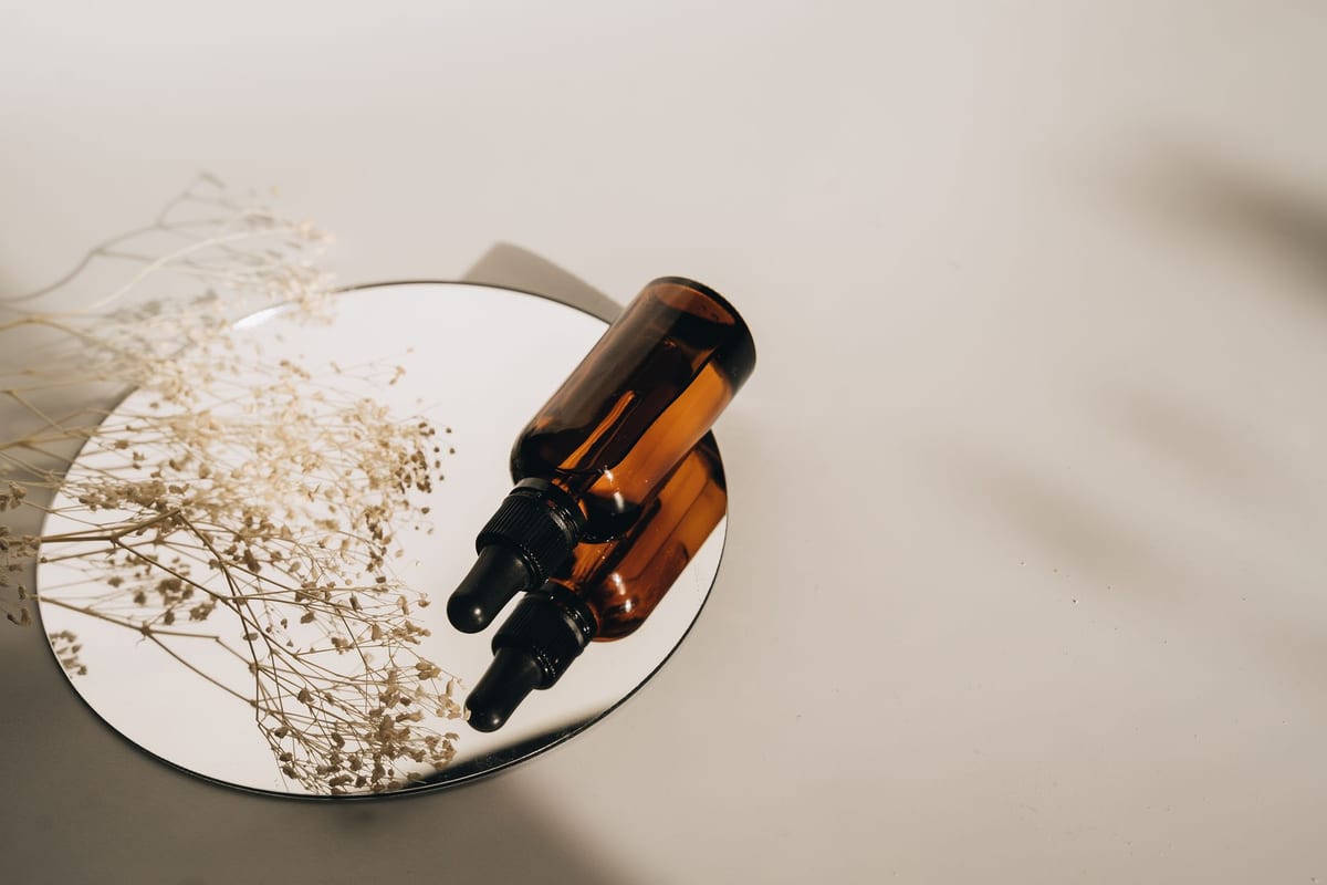 natural facial oil dropper bottle with botanicals